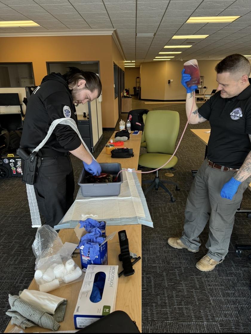 Hands-on medical training using simulated hemorrhage-control equipment.